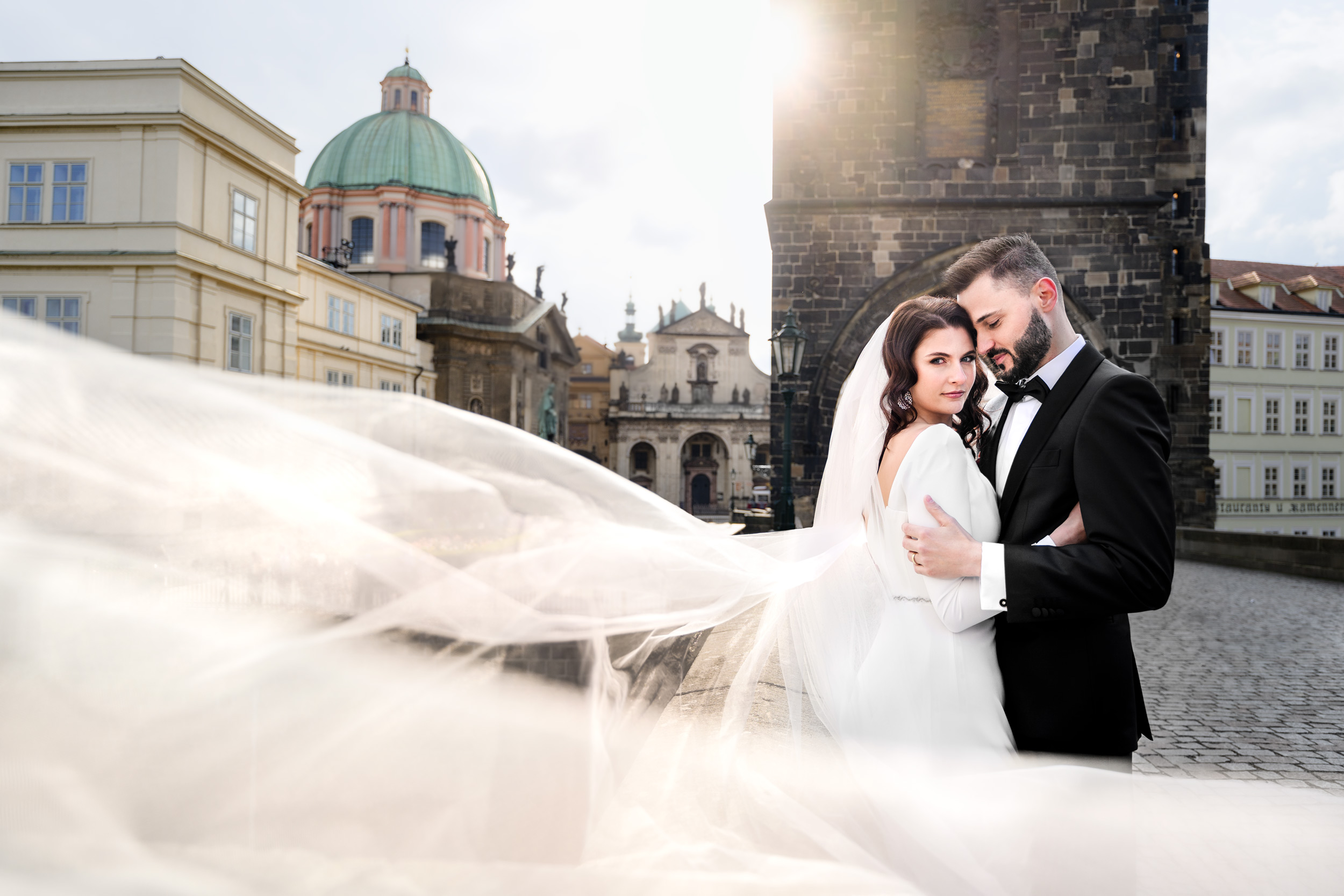bride and groom on Charles Bridge in Prague