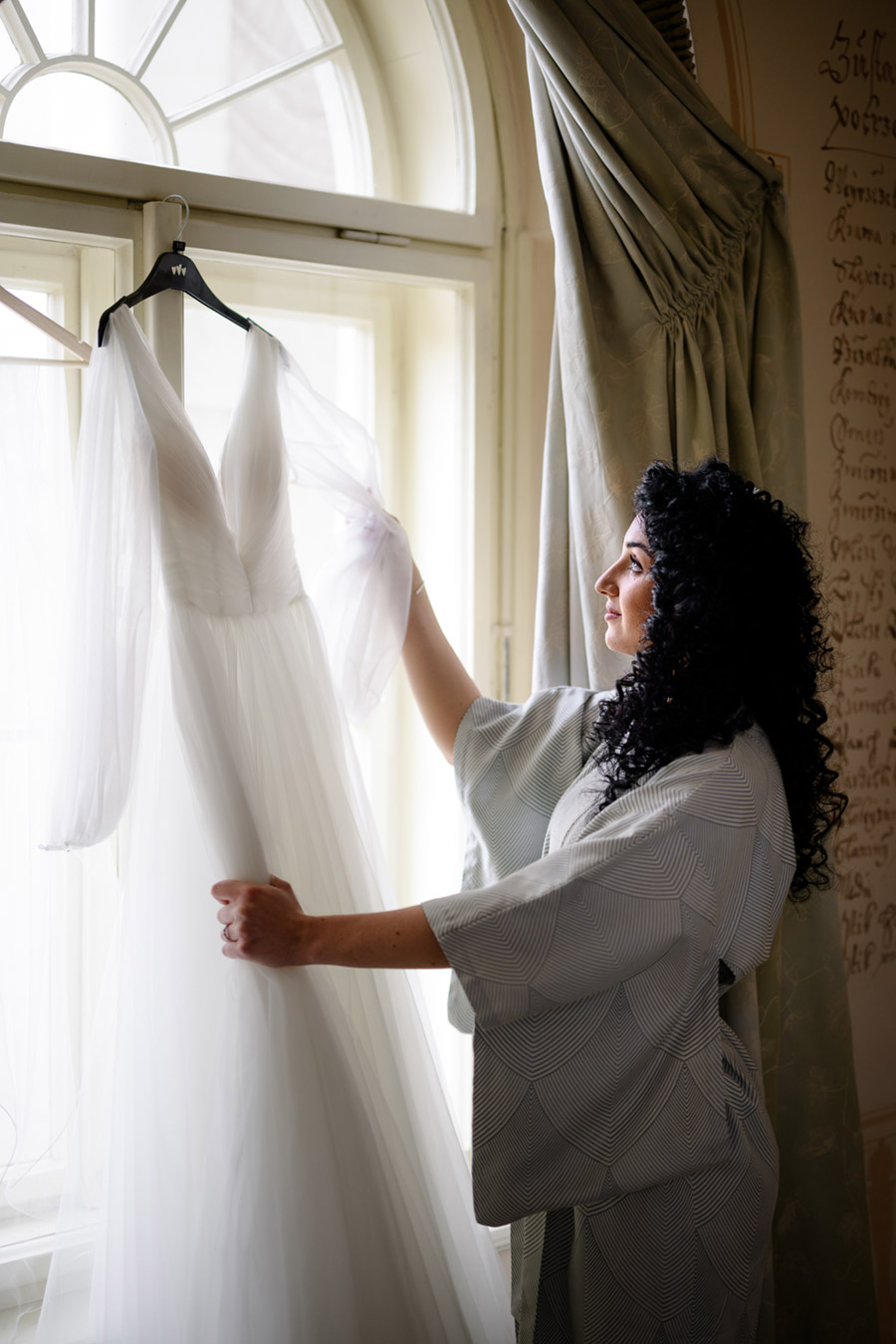 bride with her wedding dress in Prague