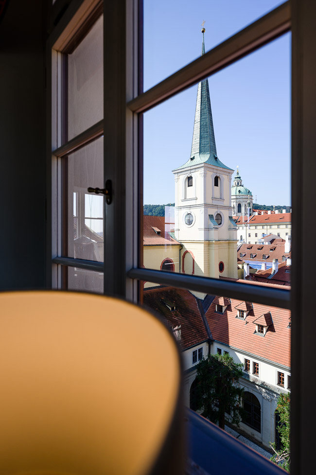 A view from the Augustine Hotel of the towers of St. Thomas Church and St. Nicholas Church in Prague.