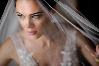 bride with a long veil over her face