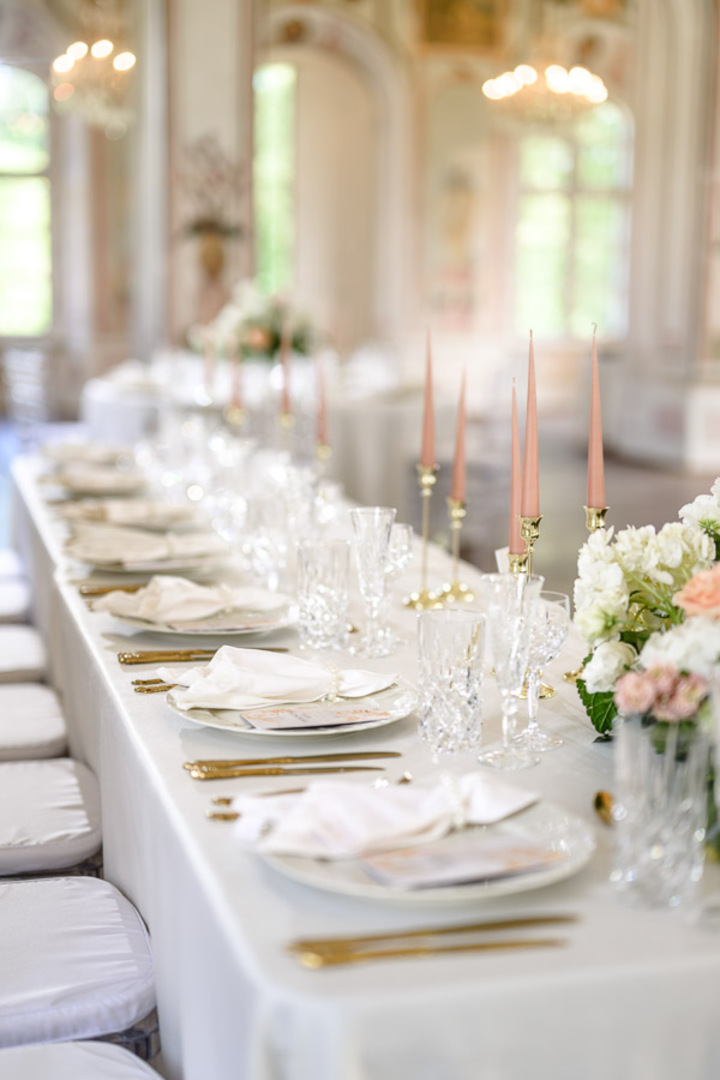 Luxurious wedding reception setup at Bon Repos, featuring elegant table settings with fine china, crystal glassware, and floral centerpieces.