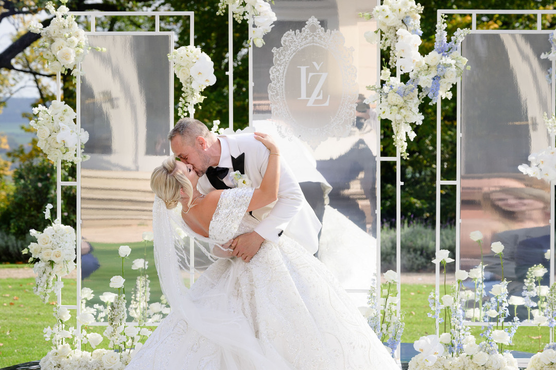 first kiss with floral decorations in the background