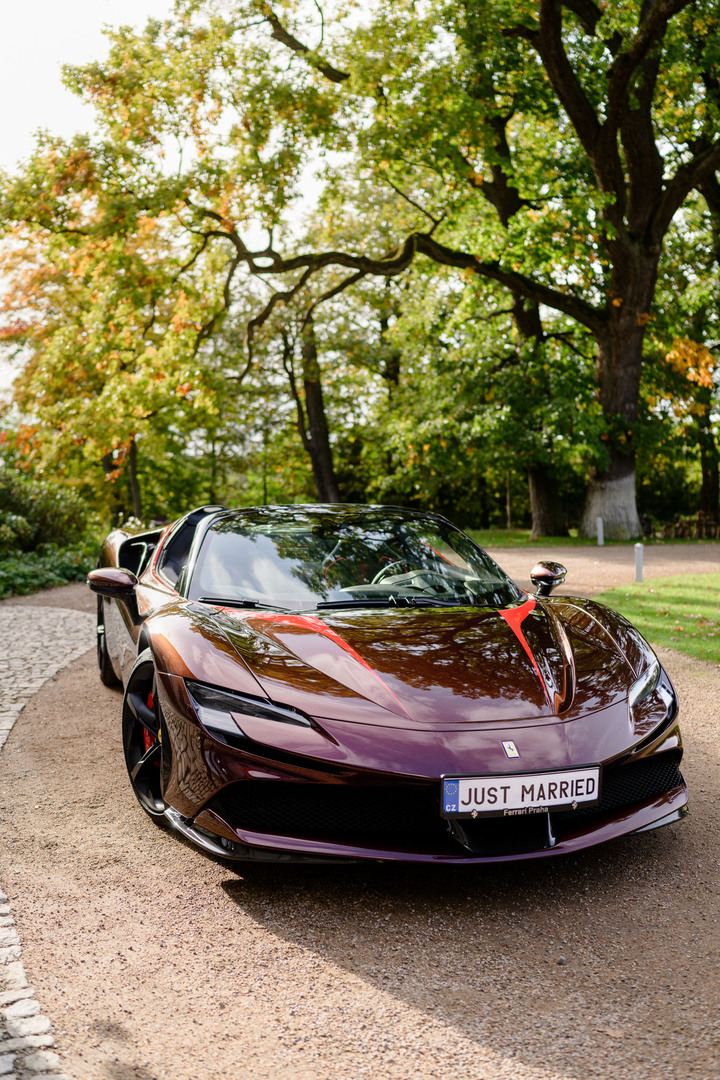 Luxury sports car with "Just Married" sign.