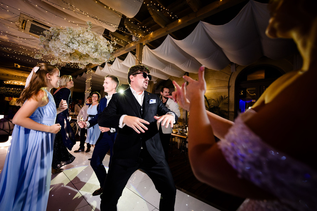 people dancing at a wedding party at Chateau Mcely