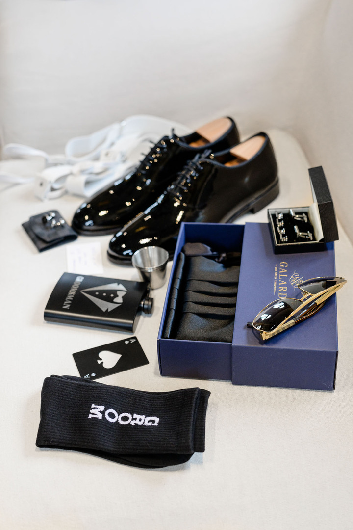 Groom’s wedding accessories – shoes, Galard bow tie, and cufflinks.