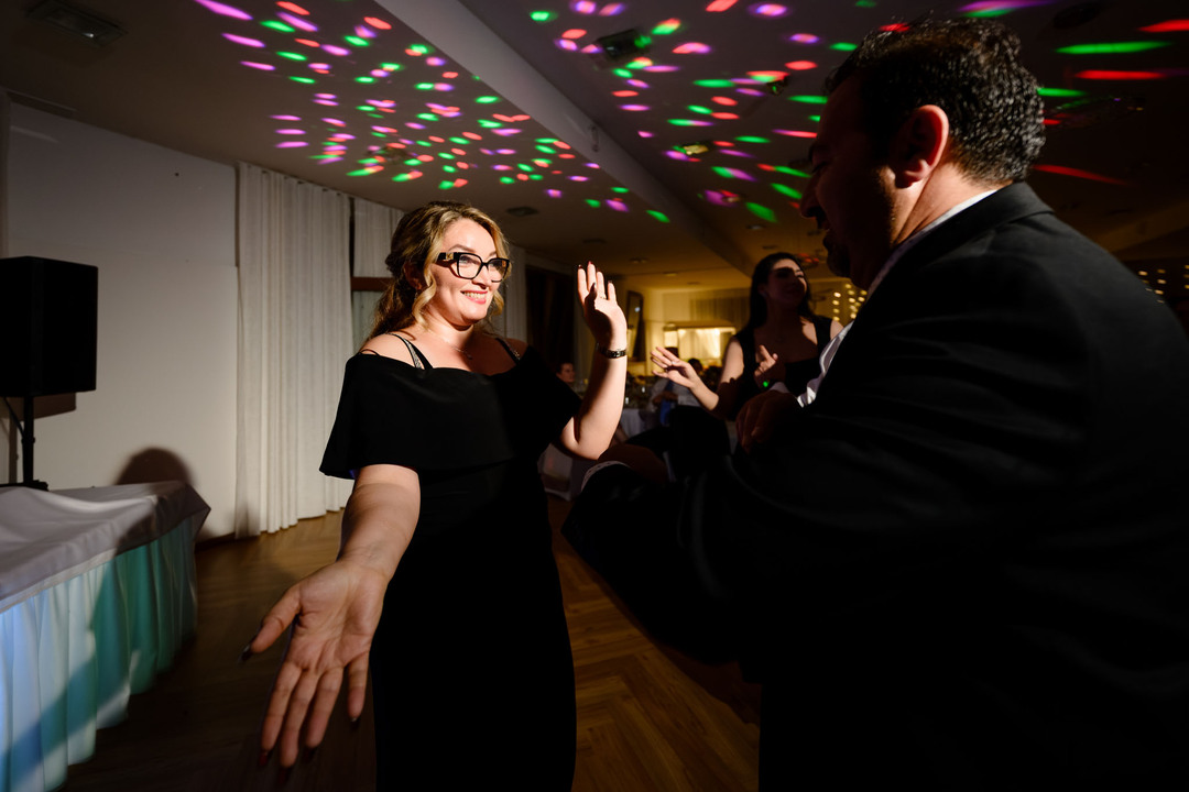 Guests dancing joyfully during the evening wedding party at Hotel & Garden U Holubů, Beskydy