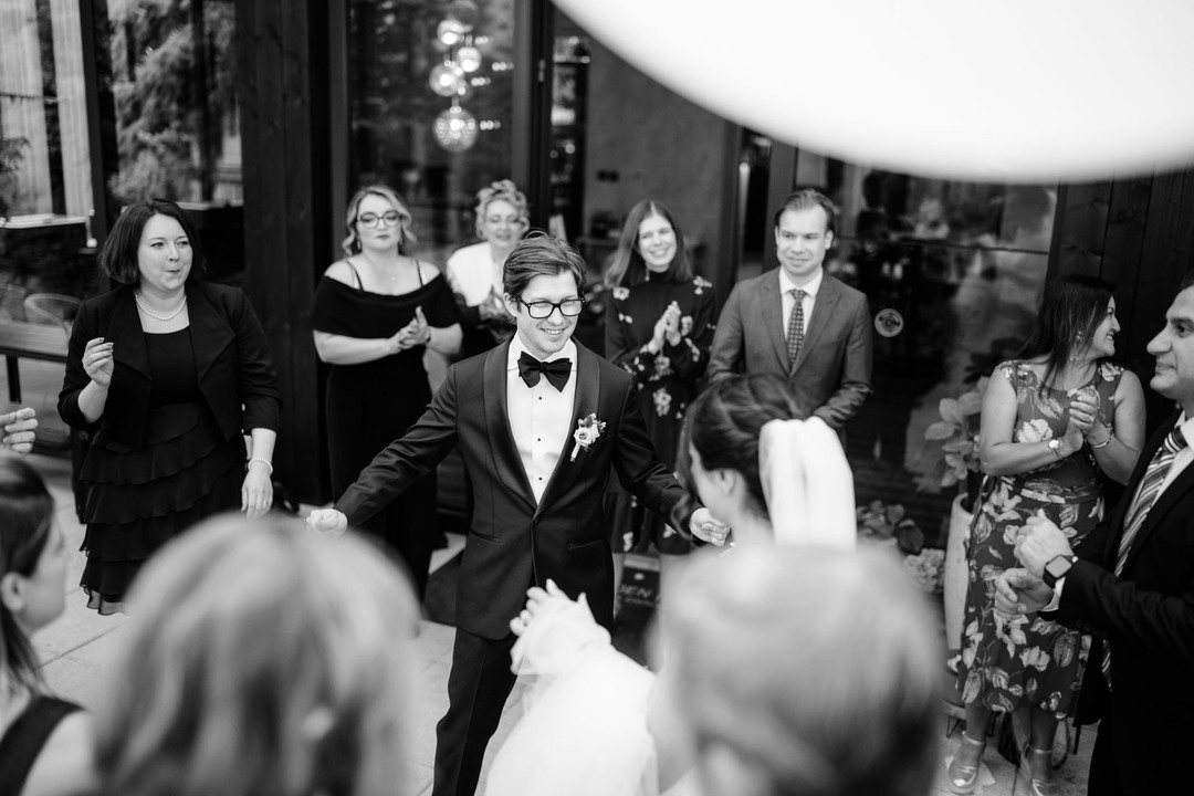 The groom joyfully dancing surrounded by loved ones on his wedding day, photographed by wedding photographer Jindřich Nejedlý in the Beskydy.
