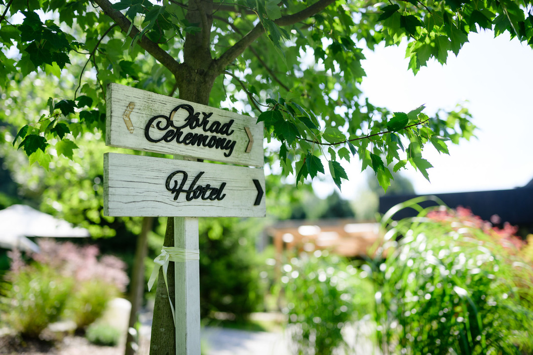 Sign with Ceremony and Hotel lettering at Hotel & Garden U Holubů.
