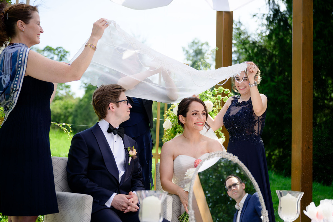 The bride and groom during an outdoor ceremony in the Beskydy Mountains.