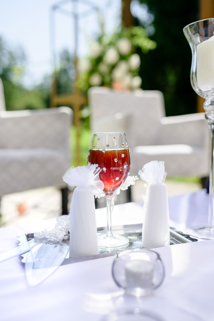 A glass filled with honey symbolizing a sweet life for the newlyweds.
