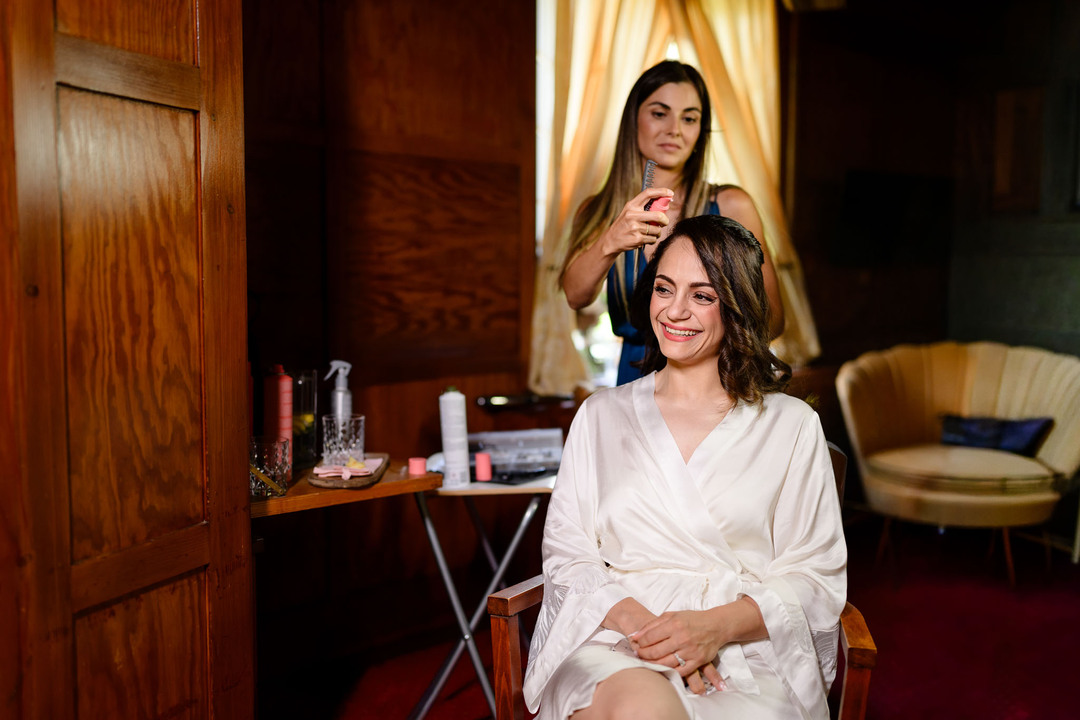 Wedding preparations at U Holubů in the Beskydy, the bride being styled by a hairdresser.
