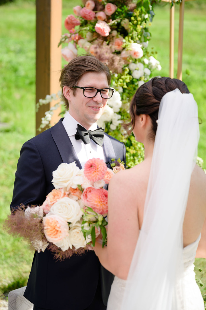 The bride and groom during an outdoor ceremony in the Beskydy Mountains.