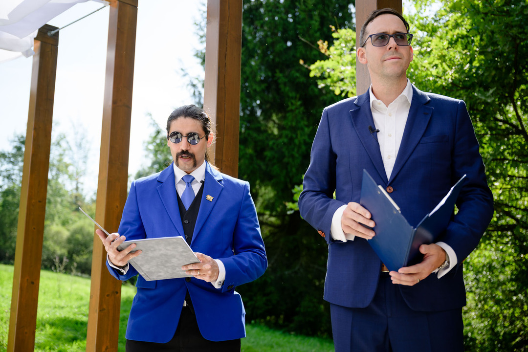The officiant conducting the wedding ceremony.
