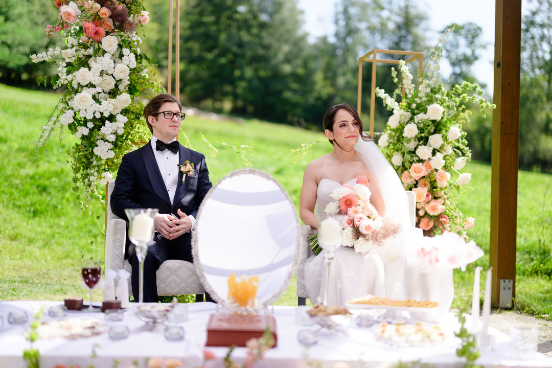Outdoor wedding ceremony in Čeladná, the bride and groom standing at the ceremony table.