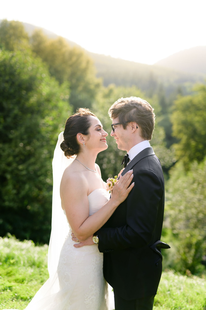 Bride and groom in a romantic embrace at Hotel & Garden U Holubů wedding in Beskydy, intimate outdoor portrait