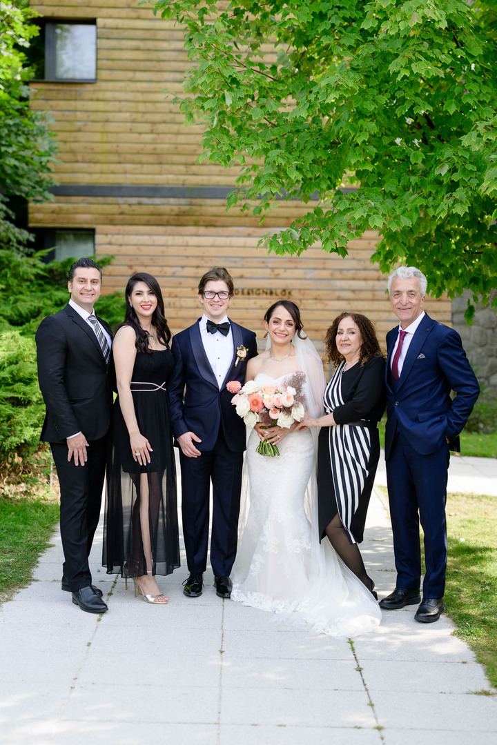 Group photographs of wedding guests in front of Hotel & Garden U Holubů, photographed by Jindřich Nejedlý.
