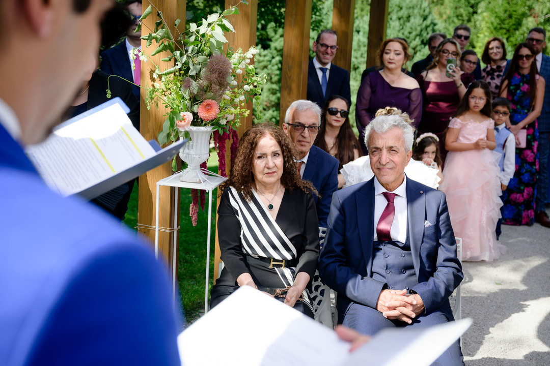 Wedding guests taking part in the ceremony.