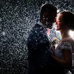 bride and groom at their rainy wedding
