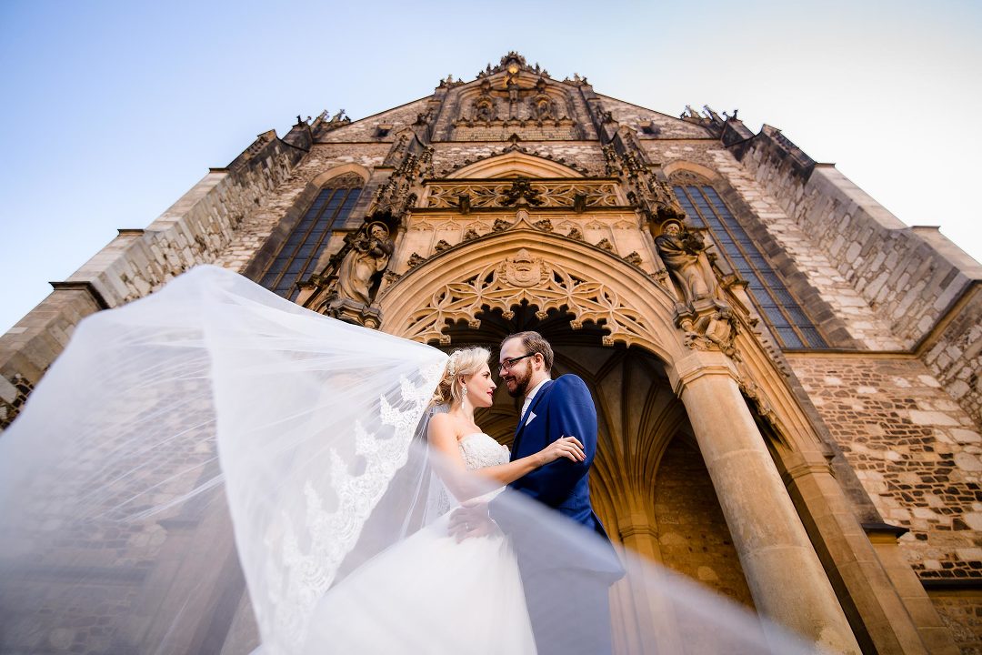 bride and groom at Cathedral of st Peter and Pavel in Brno