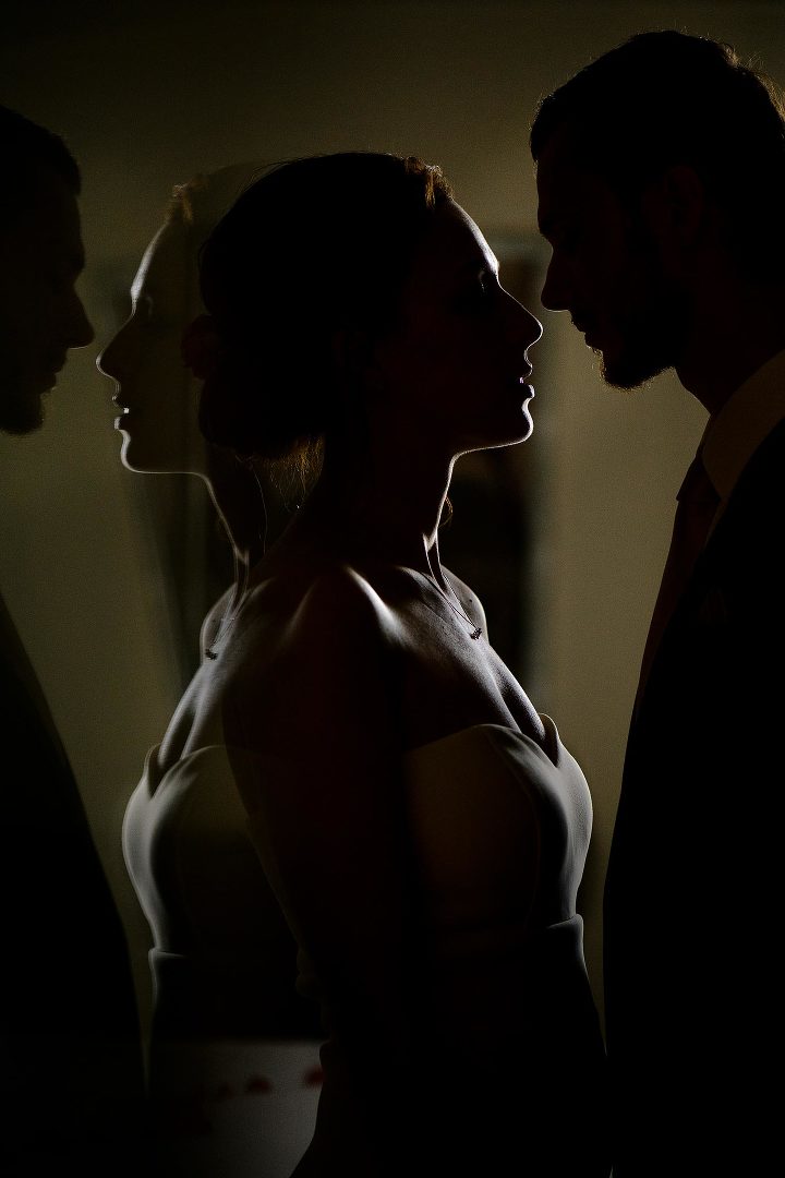 silhouettes of woman and man and their reflection