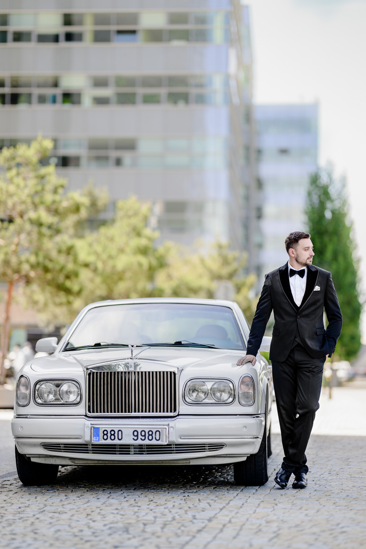 stylish groom with Rolls Royce in Brno