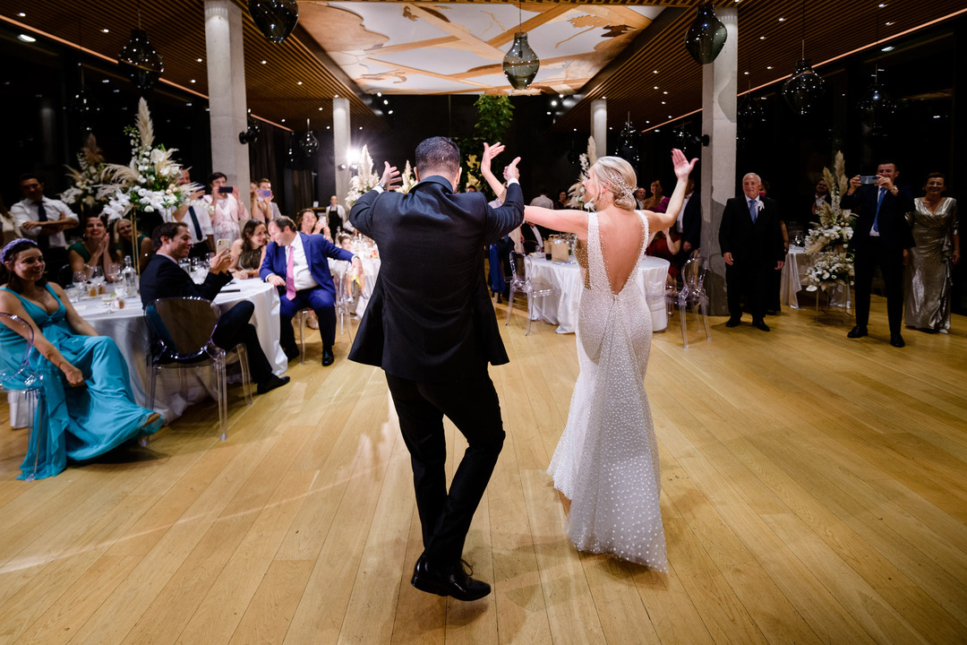 The newlyweds share a joyful dance during their wedding celebration 