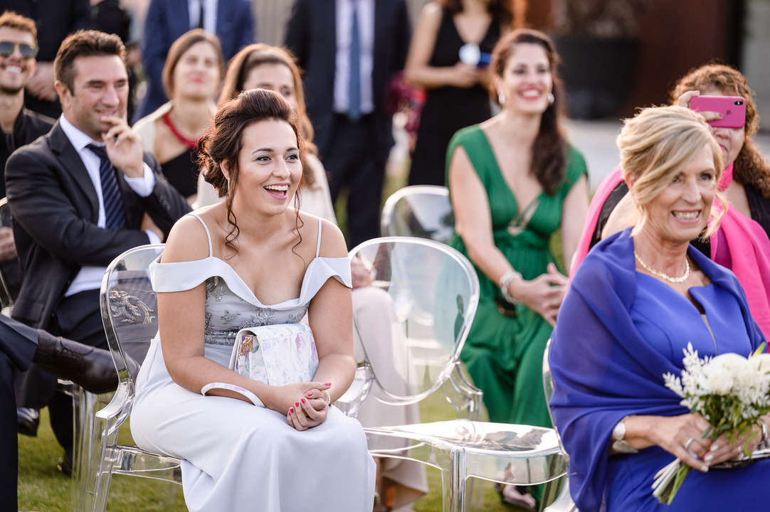 Wedding guests seated outdoors, watching the ceremony at Obelisk Winery.