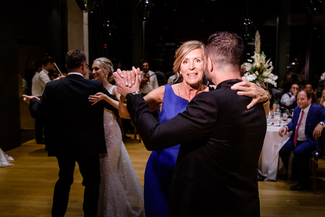 The groom dances with his mother.