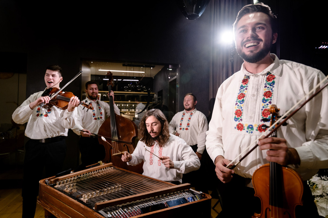 Traditional musicians performing at a wedding with folk instruments