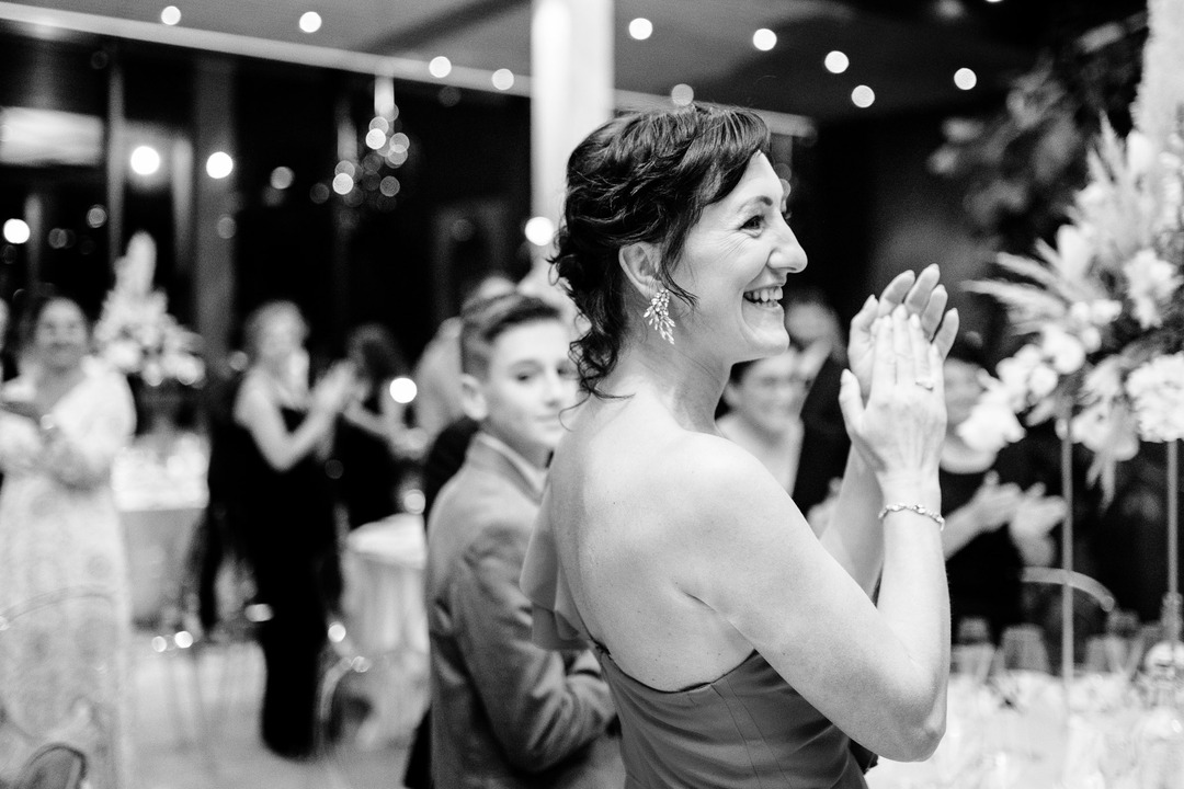 Guests clap and welcome the newlyweds.